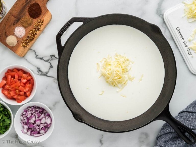 Heated half and half in skillet, adding American white cheese.
