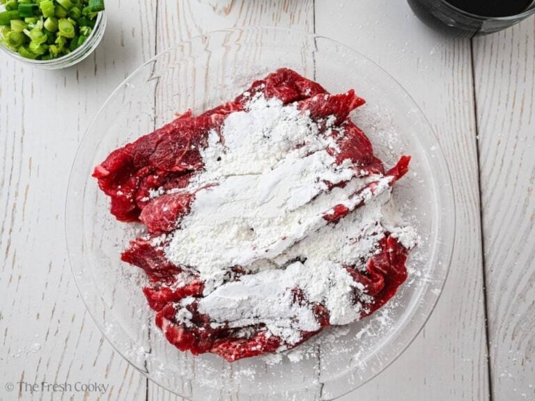 Toss the shaved steak with cornstarch.