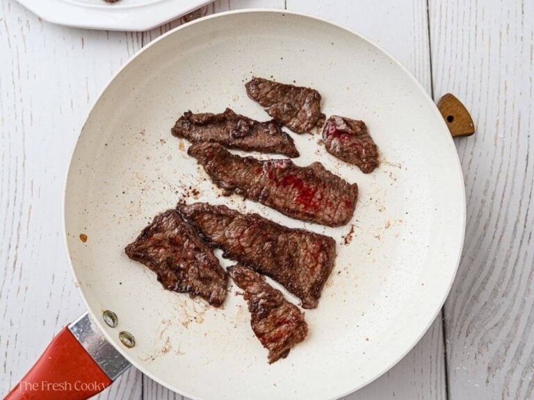Sear the beef in batches, in pan.