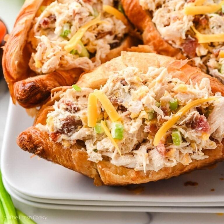 Side view of sassy scotty chicken salad in a croissant.