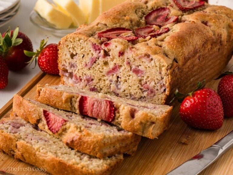 Healthy Strawberry Bread sliced on a wooden board.
