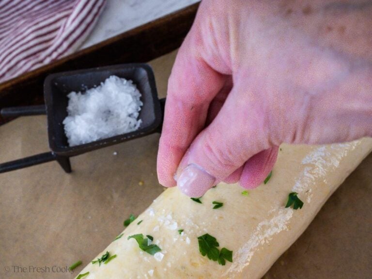 Add a little flaky sea salt to the top of stromboli.