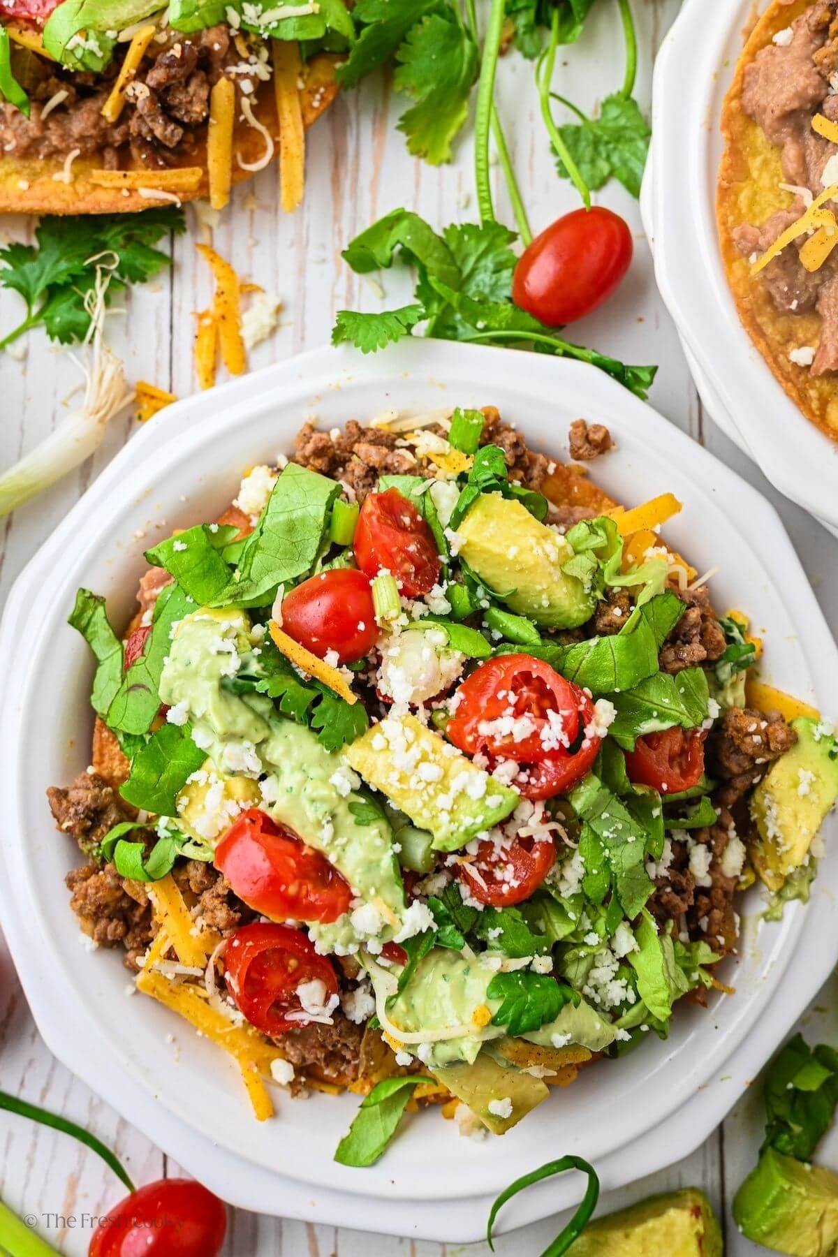 Looking down on a tostada fully loaded.