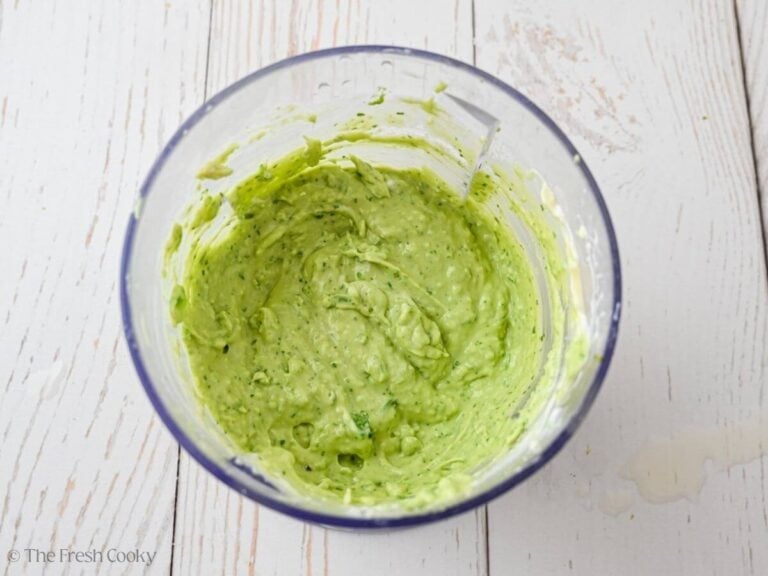 Avocado crema in food processor bowl.