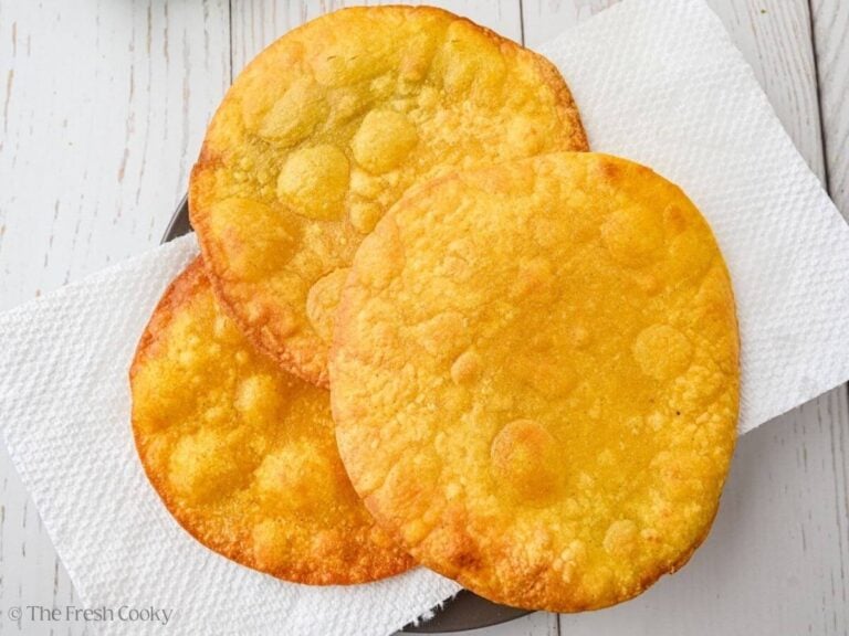 Fried tostada shells on paper towels.