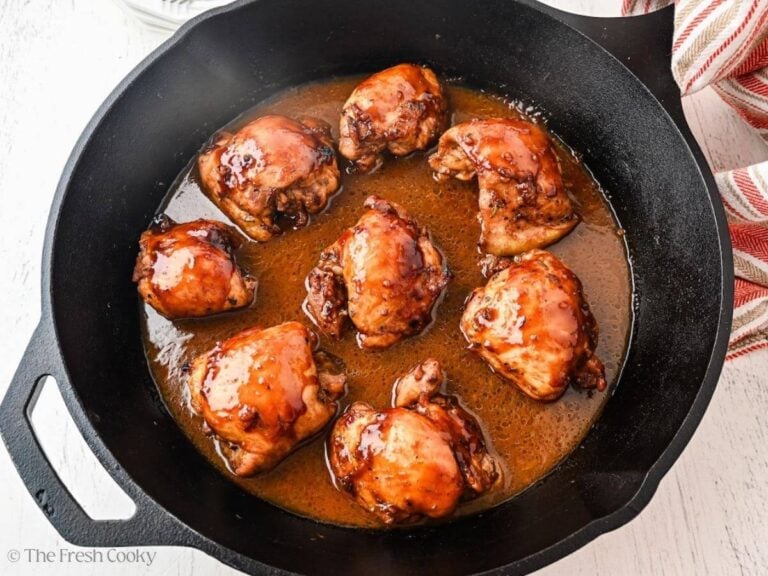 Baked balsamic honey chicken in a cast iron skillet.