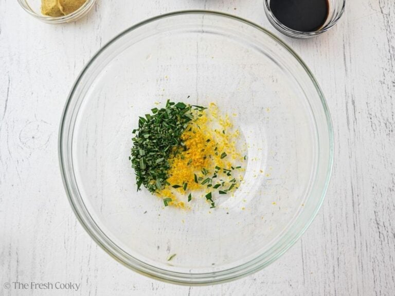 Lemon zest and chopped rosemary in a bowl.