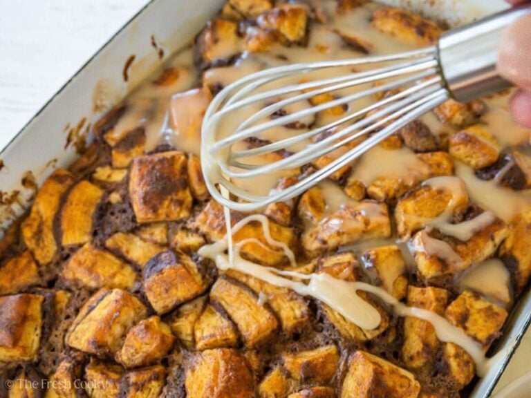 Drizzling glaze with whisk over warm casserole.