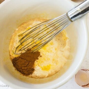 Spices and vanilla added to custard mixture.
