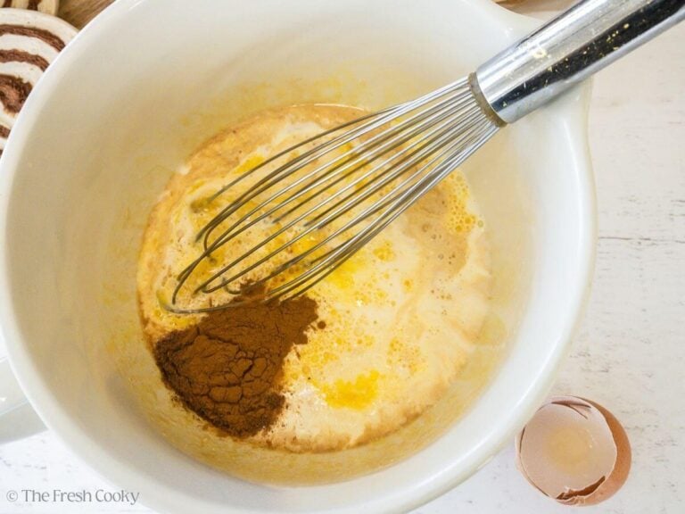 Spices and vanilla added to custard mixture.