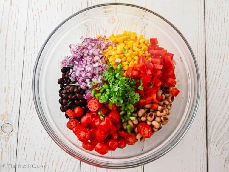 Cowboy caviar ingredients placed in a large bowl.