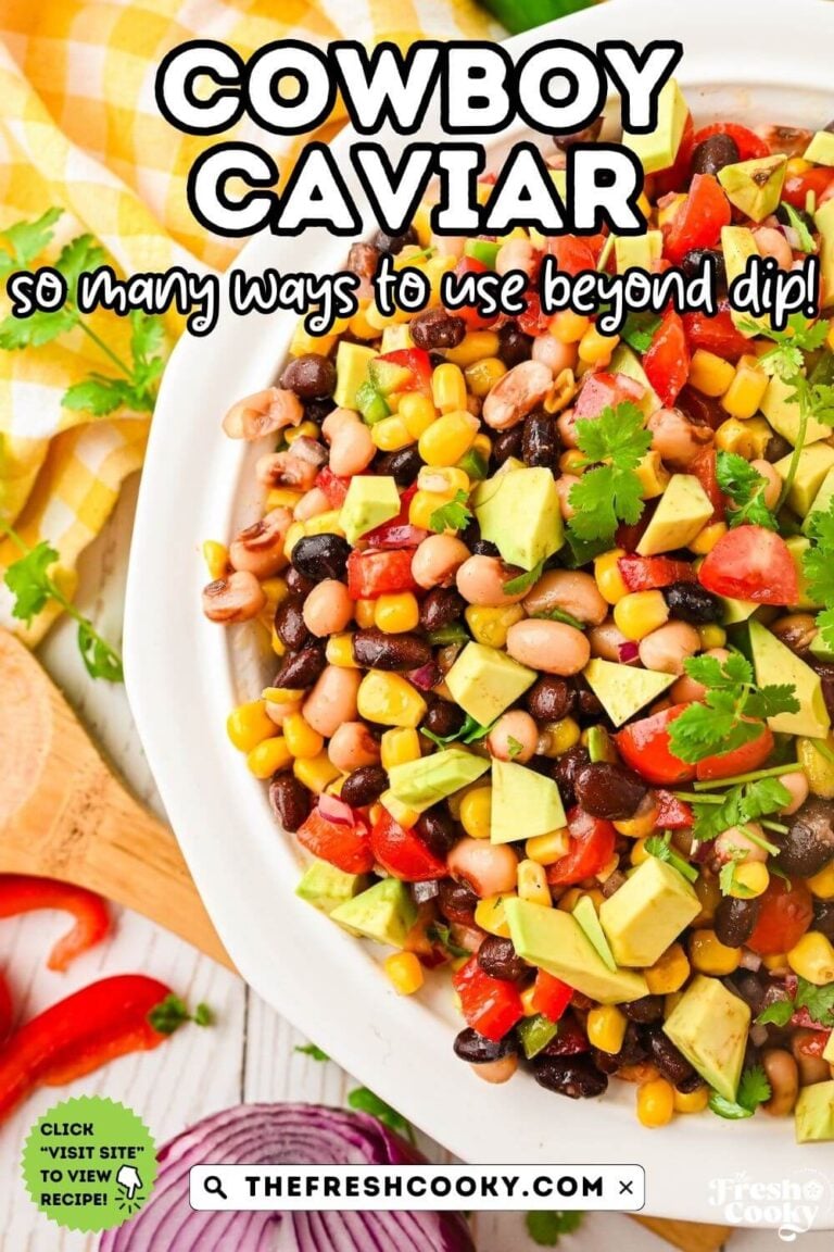 A pretty white bowl filled with colorful Texas Cowboy Caviar, a bean dip, with bright beans, corn, avocado, jalapeno, and veggies, served with tortilla chips, for pinterest.