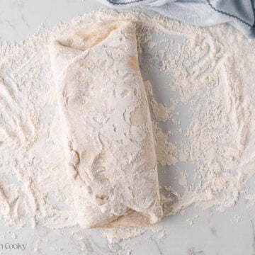 Folding the other side of the donut dough over the top.