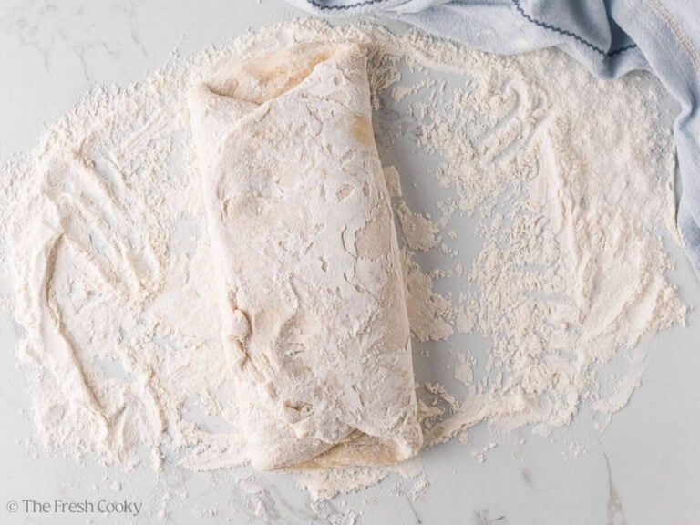 Folding the other side of the donut dough over the top.