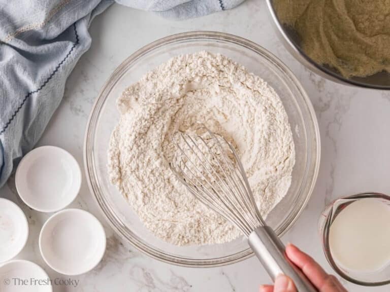 Dry ingredients in a bowl being whisked together.
