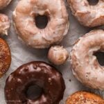 Close up of glazed homemade donuts and donut holes.