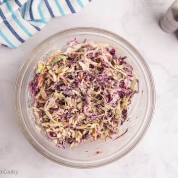 Cabbage mixed with the sauce to make a coleslaw.