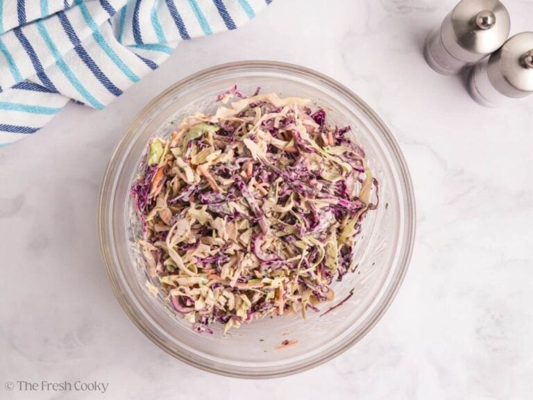 Cabbage mixed with the sauce to make a coleslaw.