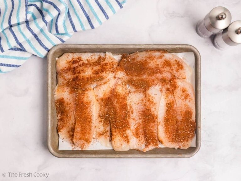 Tilapia fillets wit spice mix on top.