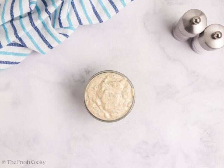 Finished cilantro sour cream sauce in a bowl.