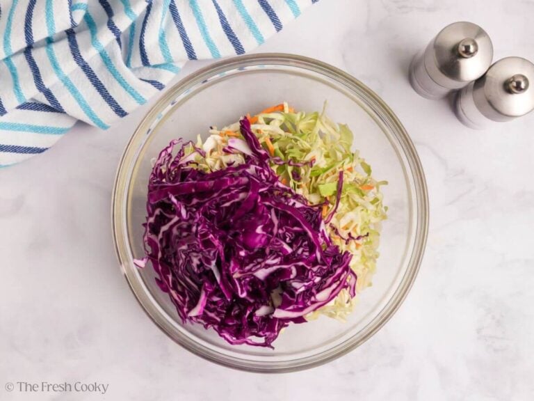 Red cabbage and coleslaw mix in a bowl.