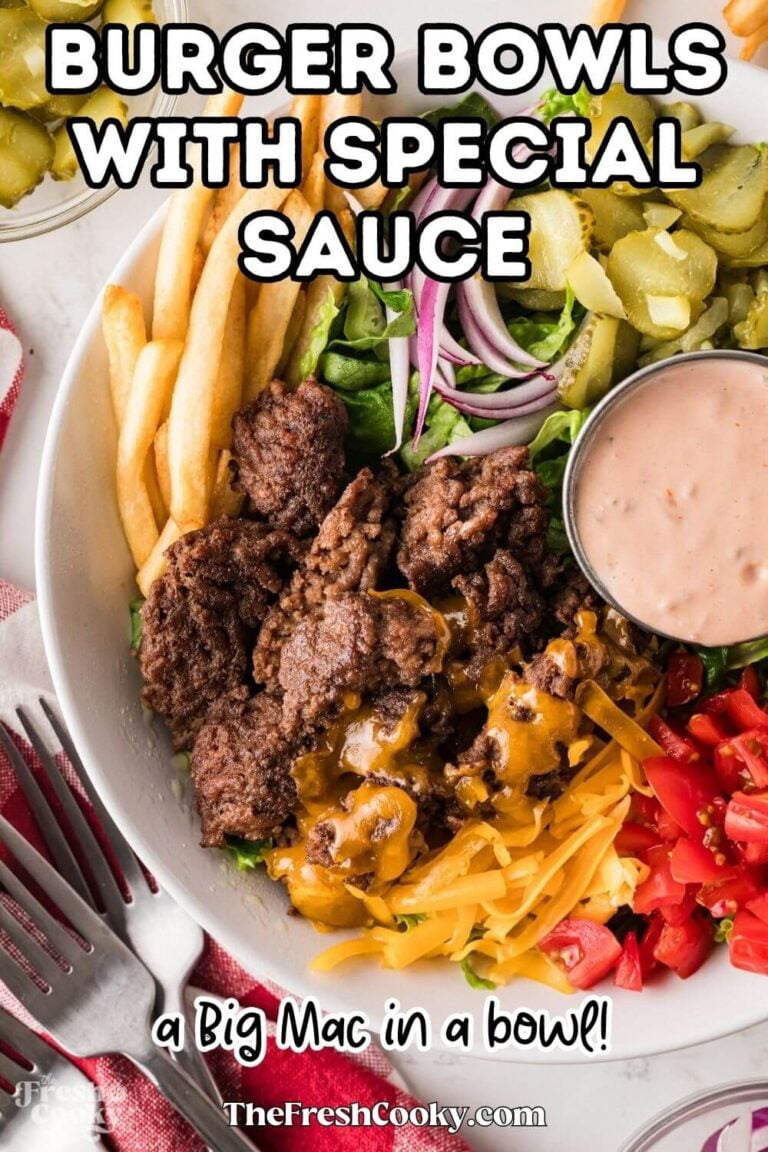 A burger bowl on a bed of lettuce, topped with special sauce, tomatoes, cheese, pickles, red onions and a side of fries tucked in, for pinning.