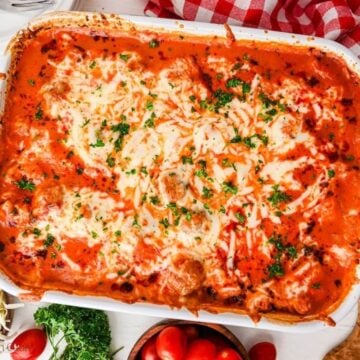 Overhead shot of finished dump and bake meatball casserole in a white baking dish.