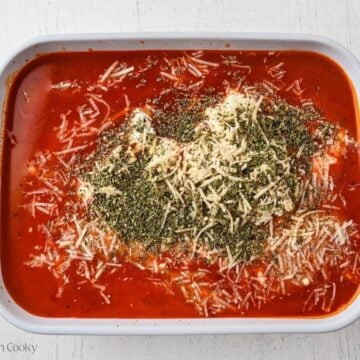Milk, cottage cheese, spices and shredded parmesan cheese added to the marinara.