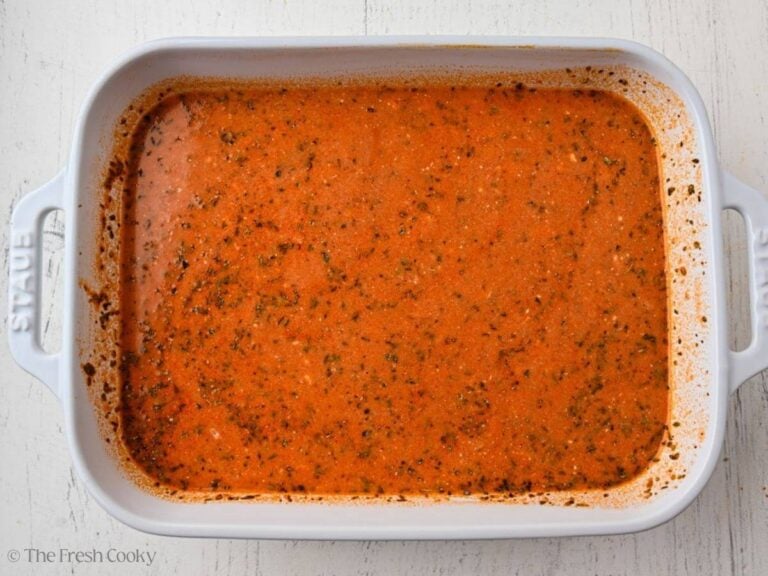 Meatball casserole sauce all mixed together in the baking dish.
