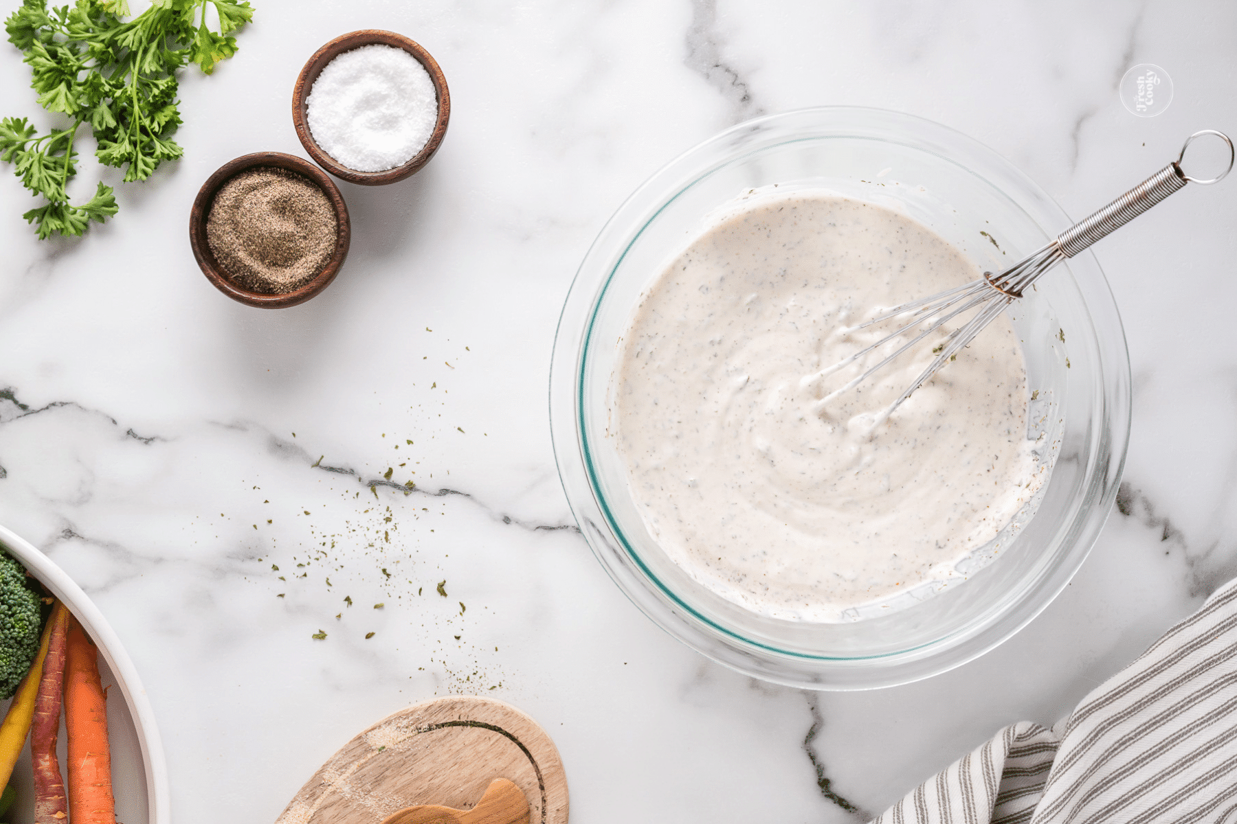 Whisking veggie dip ingredients into smooth dip.