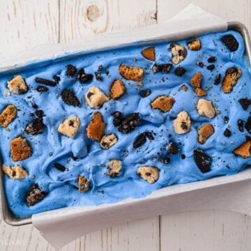 Extra cookie bits added to the top of the blue ice cream mixture.
