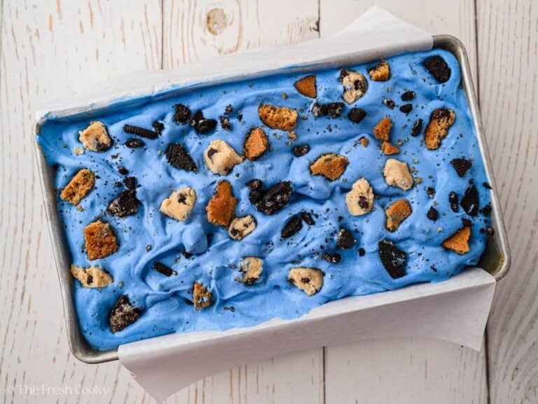 Extra cookie bits added to the top of the blue ice cream mixture.