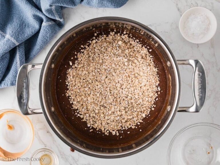 Quick cook oats added to the chocolate peanut butter mixture in a saucepan.