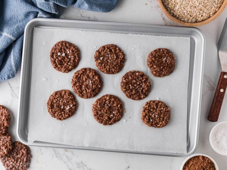 Finished no bake chocolate oat cookies on a sheet pan.