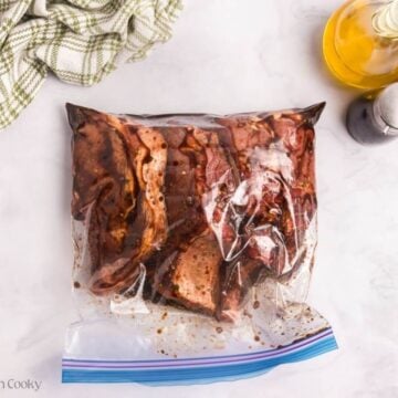 Pork chops in a bag mixed together with the marinade.