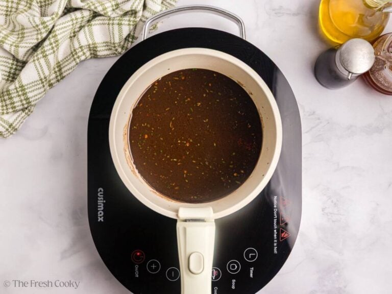 Pork chop marinade in a saucepan to cook.