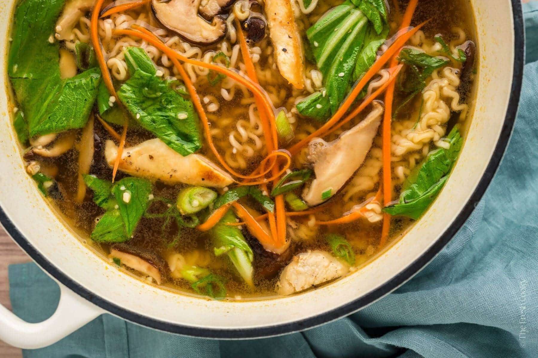 Overhead shot of homemade ramen in a large Dutch oven pot.