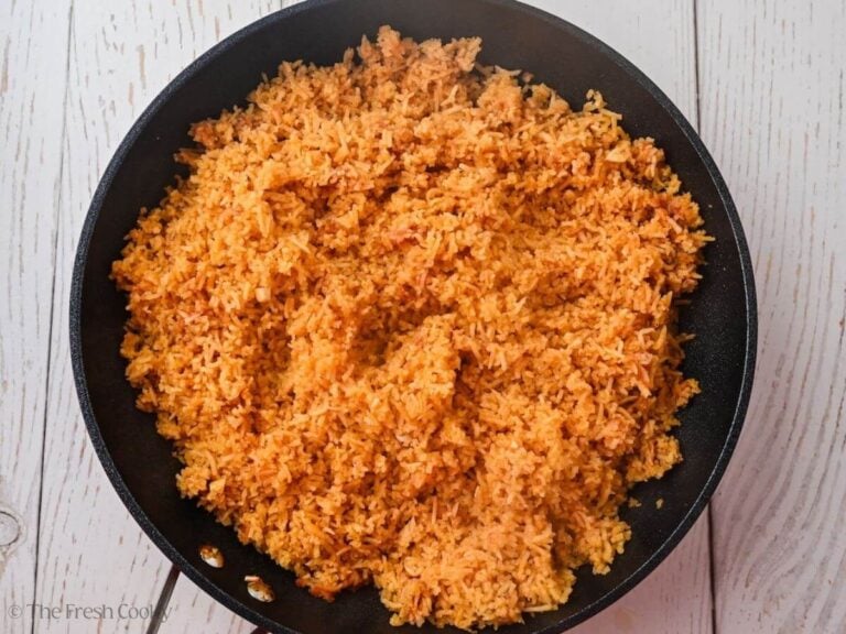 Spanish rice all stirred after being cooked in a skillet.
