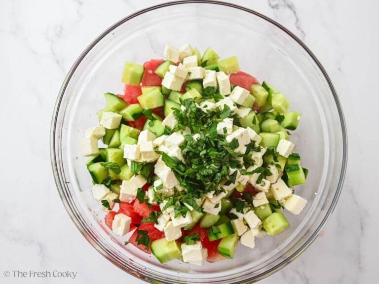 Watermelon, cucumber, feta, and mint in a large bowl.