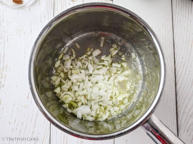 Chopped onion added to the melted butter in a saucepan.
