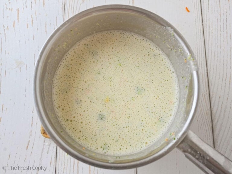 Boiling soup mixture in a pot after being blended a bit.