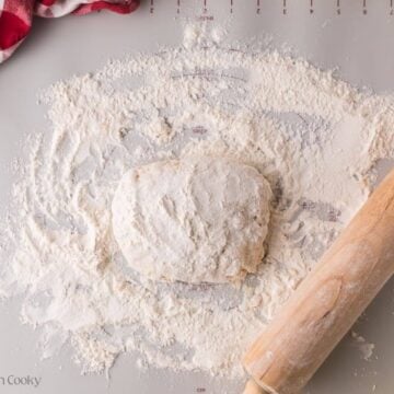 Dumpling dough with more flour placed on top.