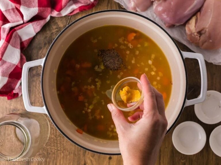 A bay leaf, pepper, and better than bouillon added to the large pot of soup.