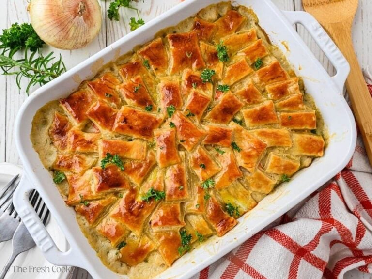 Baked easy chicken pot pie in a white baking dish.