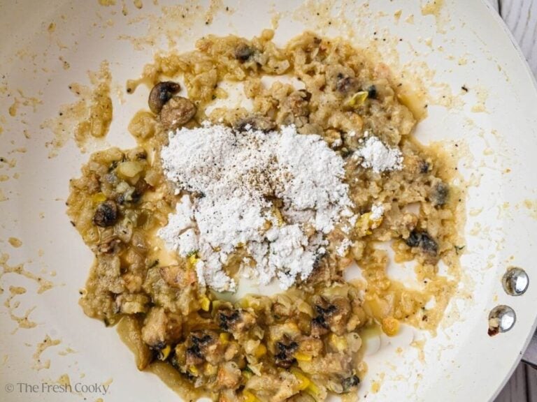 Flour added to the mushrooms, onion, butter, and olive oil.