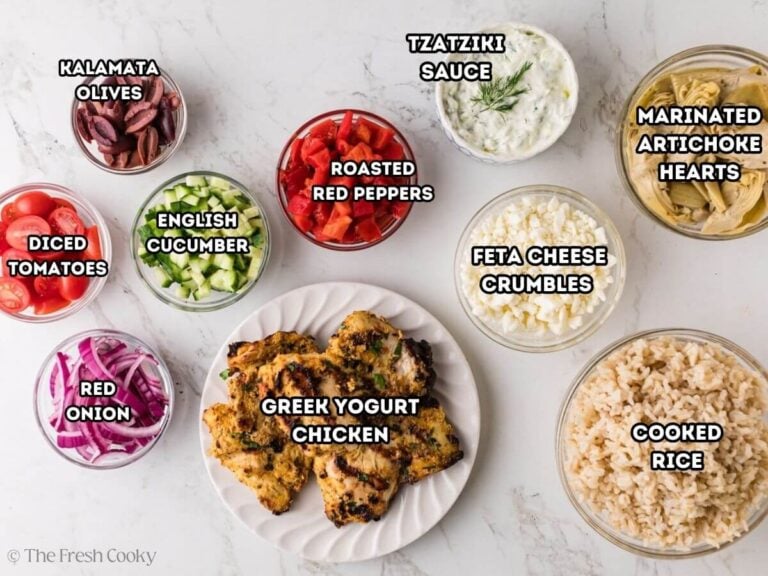 Ingredients needed to make Greek chicken bowls on a kitchen counter.
