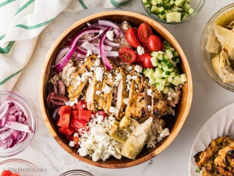 Feta placed on top of the Greek chicken bowl.