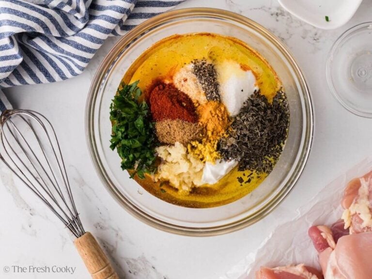 Ingredients for marinade in a glass bowl, ready to whisk.