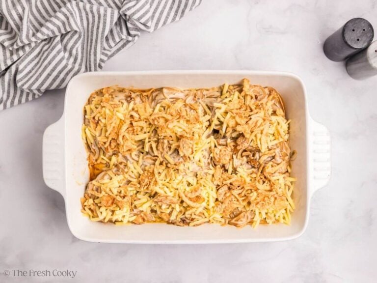Pork cho casserole mixture topped with crispy onions in a baking dish.