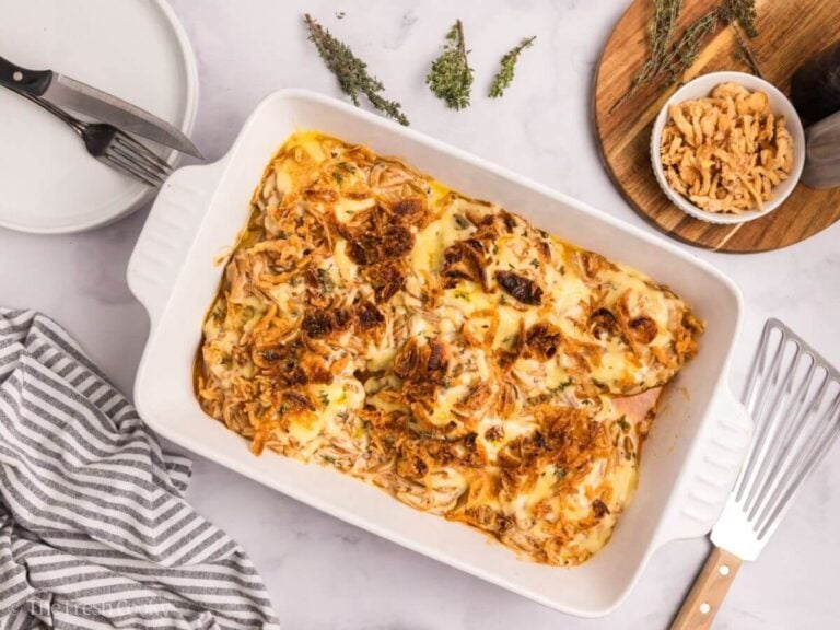 Baked pork chop casserole in a white baking dish.